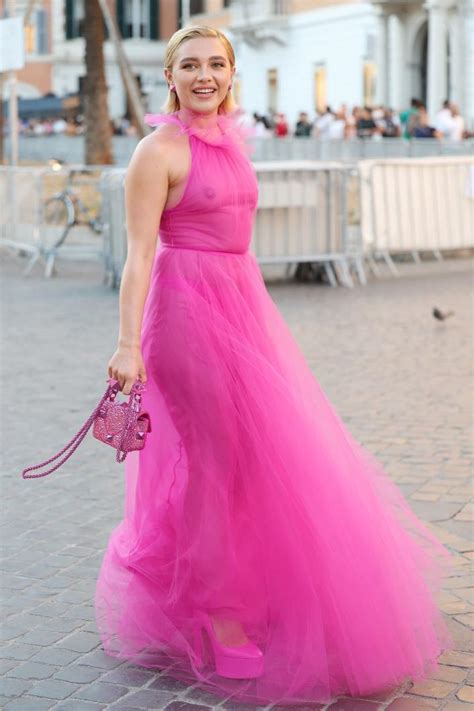 Florence Pugh left little to the imagination for her latest appearance in Rome, Italy. The "Little Women" star hopped on board the Barbiecore trend by sporting a hot pink gown for Saturday's ...